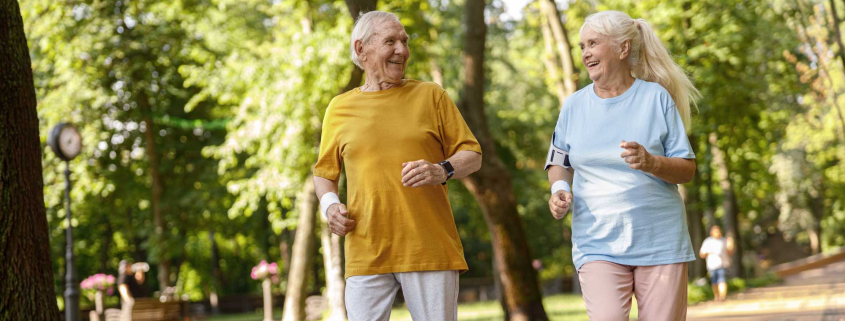 elderly couple running
